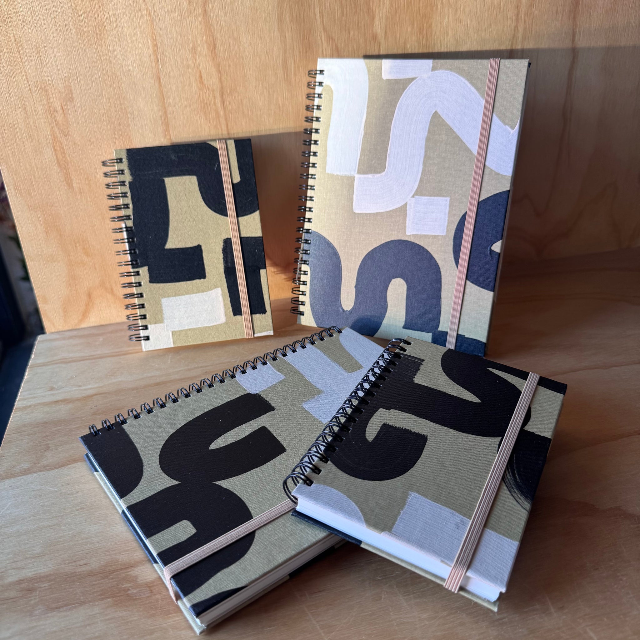 Black and Tan Notebook by Moglea